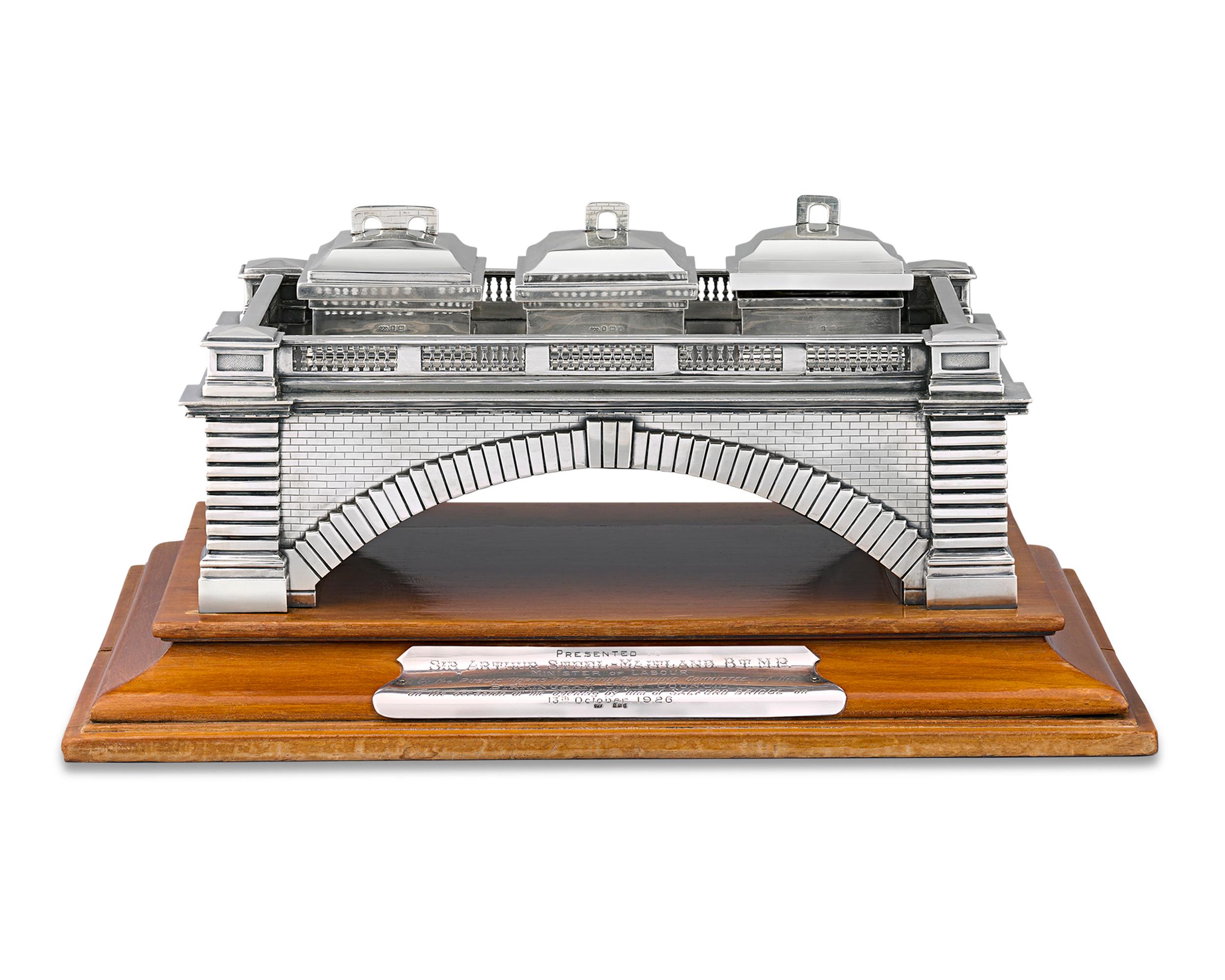 This superlative silver inkwell was presented to Sir Arthur Steel-Maitland, the United Kingdom’s Minister of Labour, on the occasion of the opening of the Salford Bridge in Birmingham. The charming inkstand was designed by the noted Birmingham firm