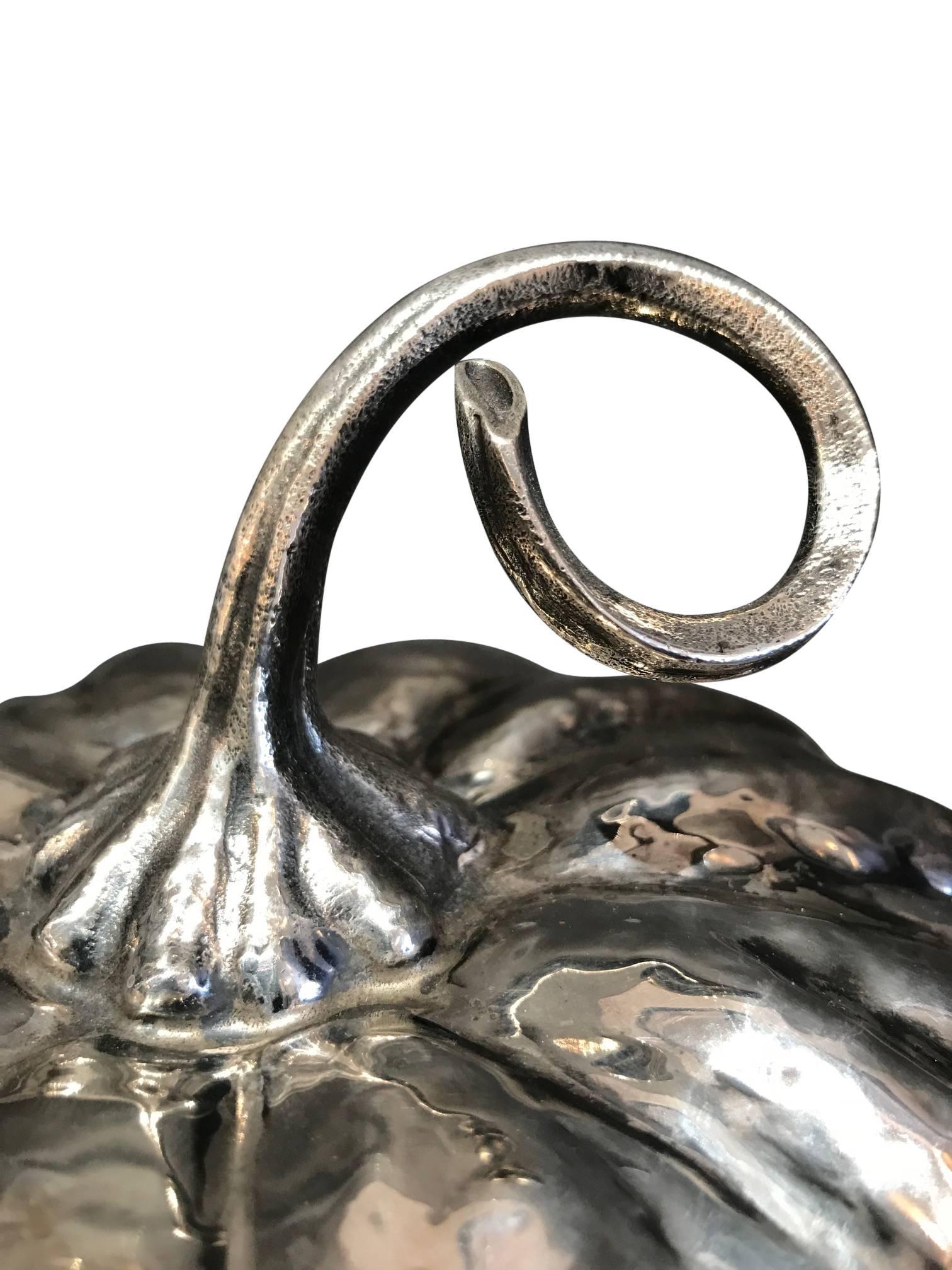 A Rare Silver Pumpkin with glass dish by Mario Buccellati, circa 1950.  Stamped M. Buccellati 925.

In 1919 Mario Buccellati opened his activity and, after the establishment of stores in Milan, Rome, Florence, began the development of overseas