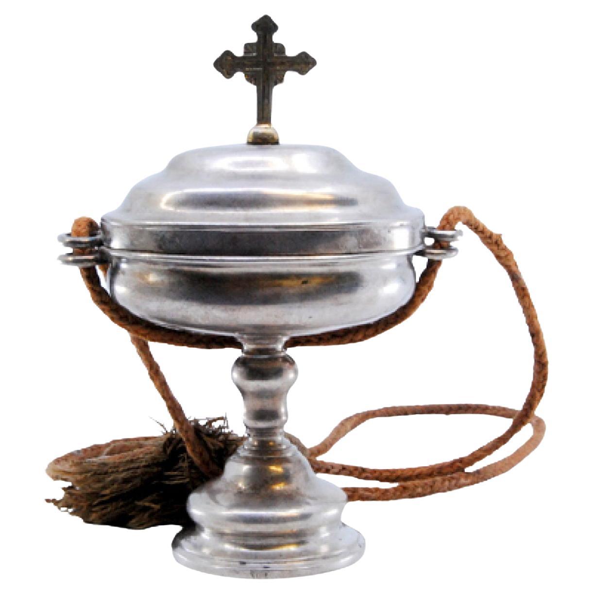 Silver pyx with cross on the lid and suspension cord For Sale