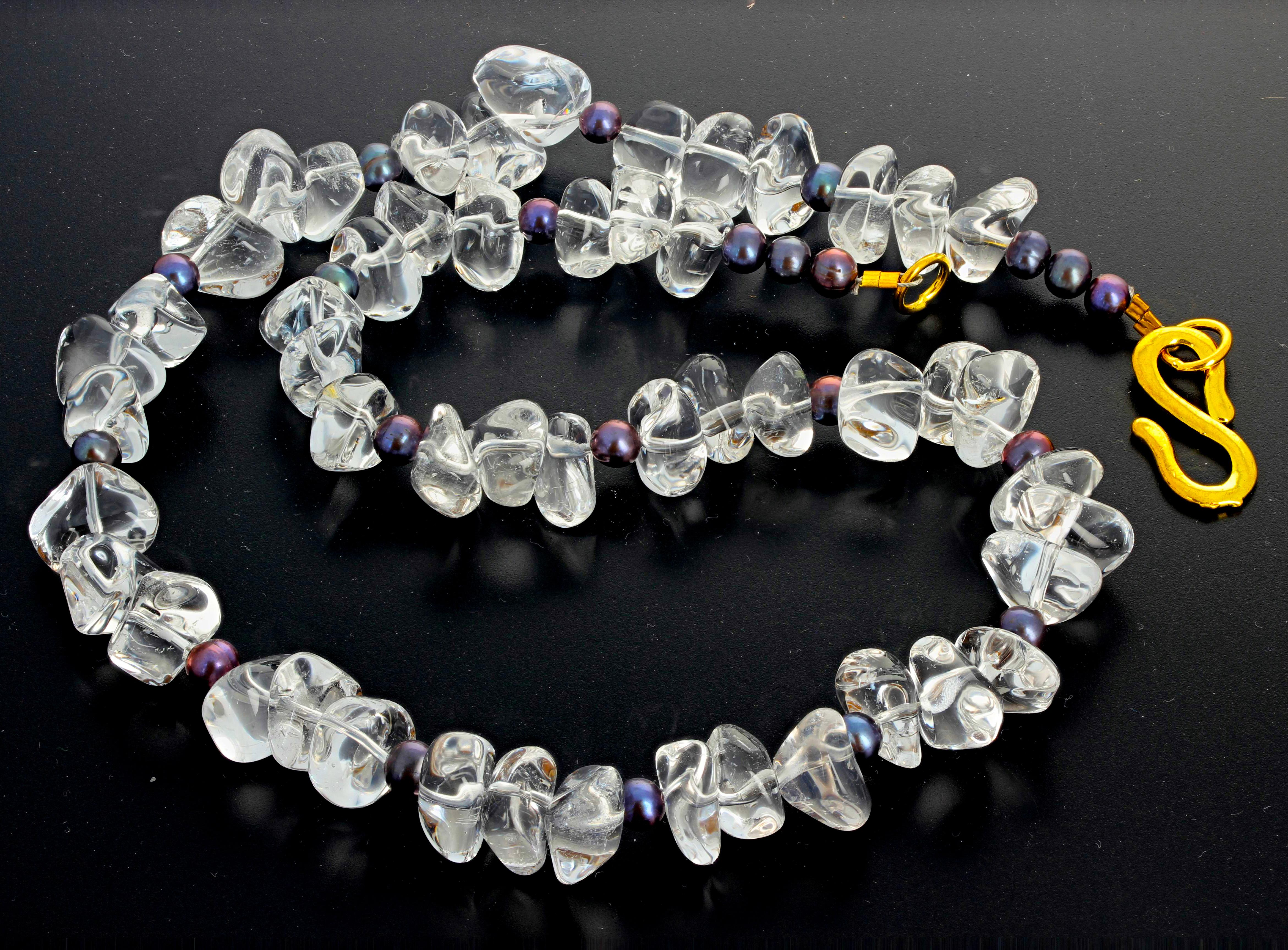 Highly polished unique chunks of flippy floppy silvery translucent Quartz accented with small round Peacock Pearls in this 19.25 inch long necklace with easy to use goldy tone hook clasp.  The large Quartz are approximately 13 mm.  More from this