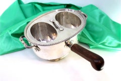 Silver rechaud with twin tanks, raised friezes & wooden handle
