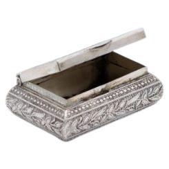 Silver rectangular pill box with flower reliefs