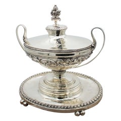 Silver relief tureen with four support feet