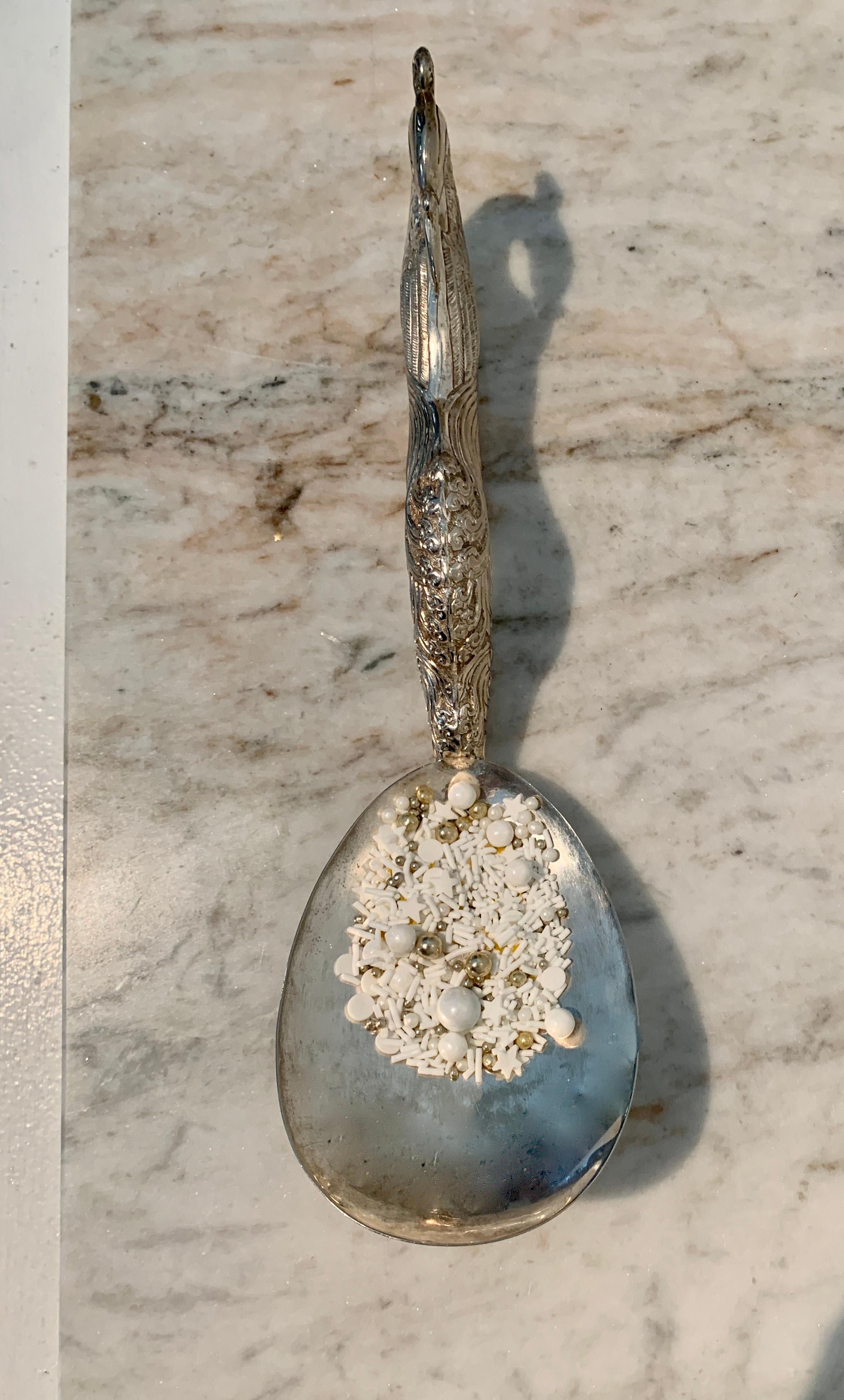 A most wonderful addition to any table - a serving spoon that will make your friends talk to each other. An intricately detailed Repoussé peacock handled spoon. One of the most impressive utensils I have seen.  Not certain if this is plate or