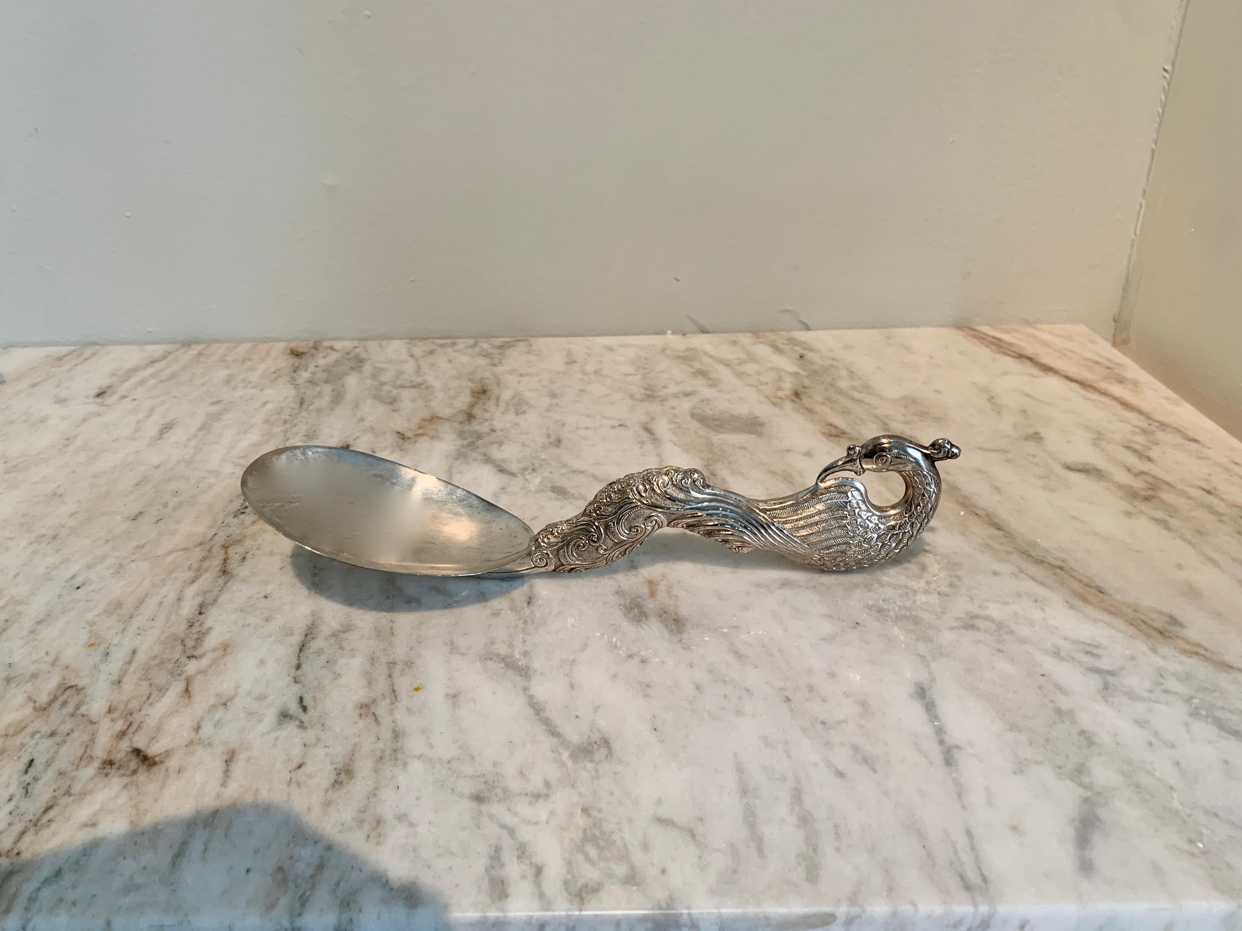 Patinated Silver Repoussé Serving Spoon with Peacock For Sale