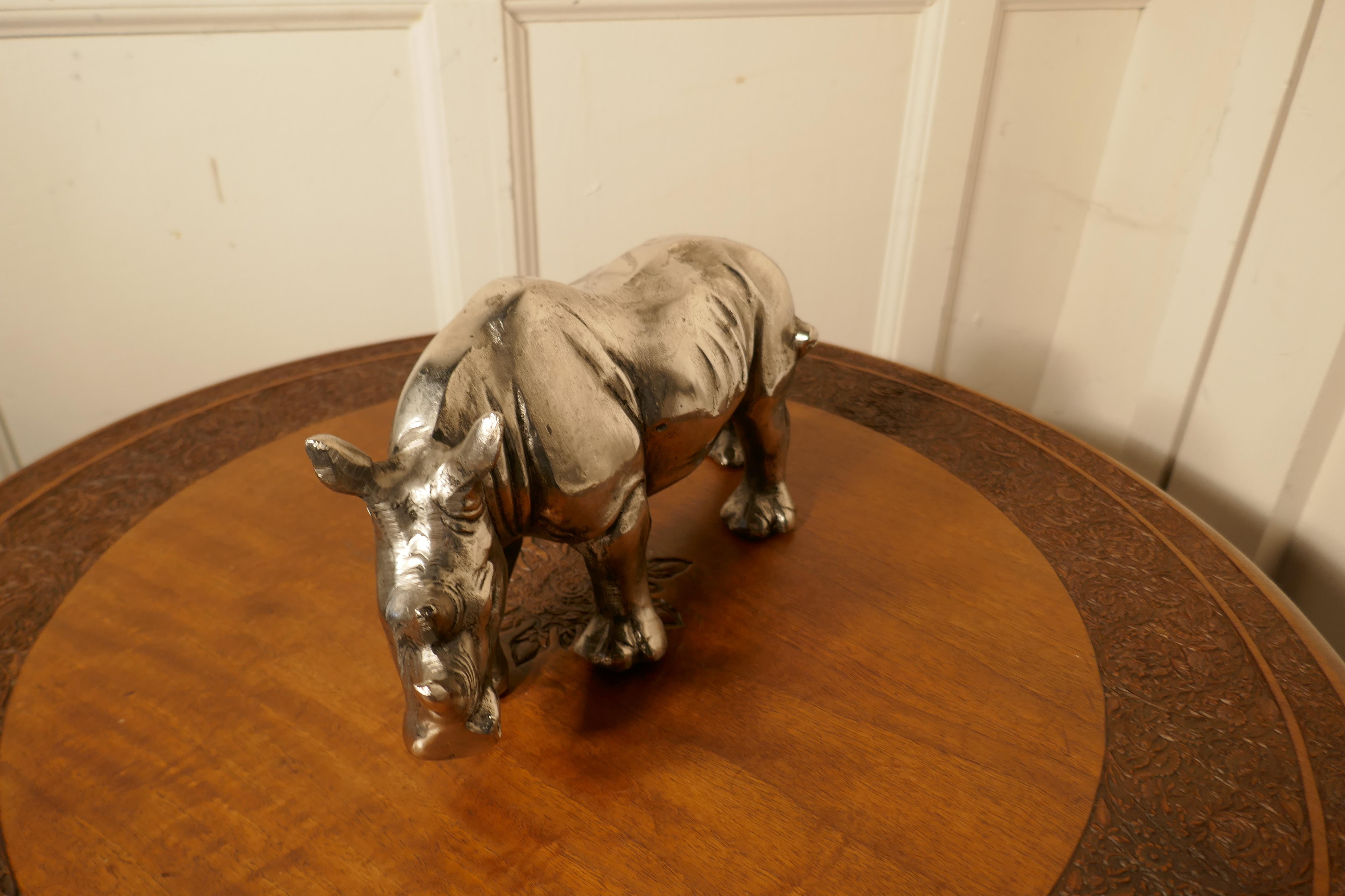 Silver rhino desk ornament

This charming piece is cast in steel with a silver finish
This is fine quality heavy piece with handsome Rhino
A lucky piece no doubt
The rhino is 7 “ high, 13” long and 5” wide
TPG58.