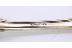 Silver rice and serving spoon with a long, scalloped handle