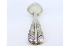 Silver rice and serving spoon with acanthus leaves embossed on the handle