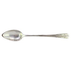 Silver rice and serving spoon with acanthus leaves embossed on the handle