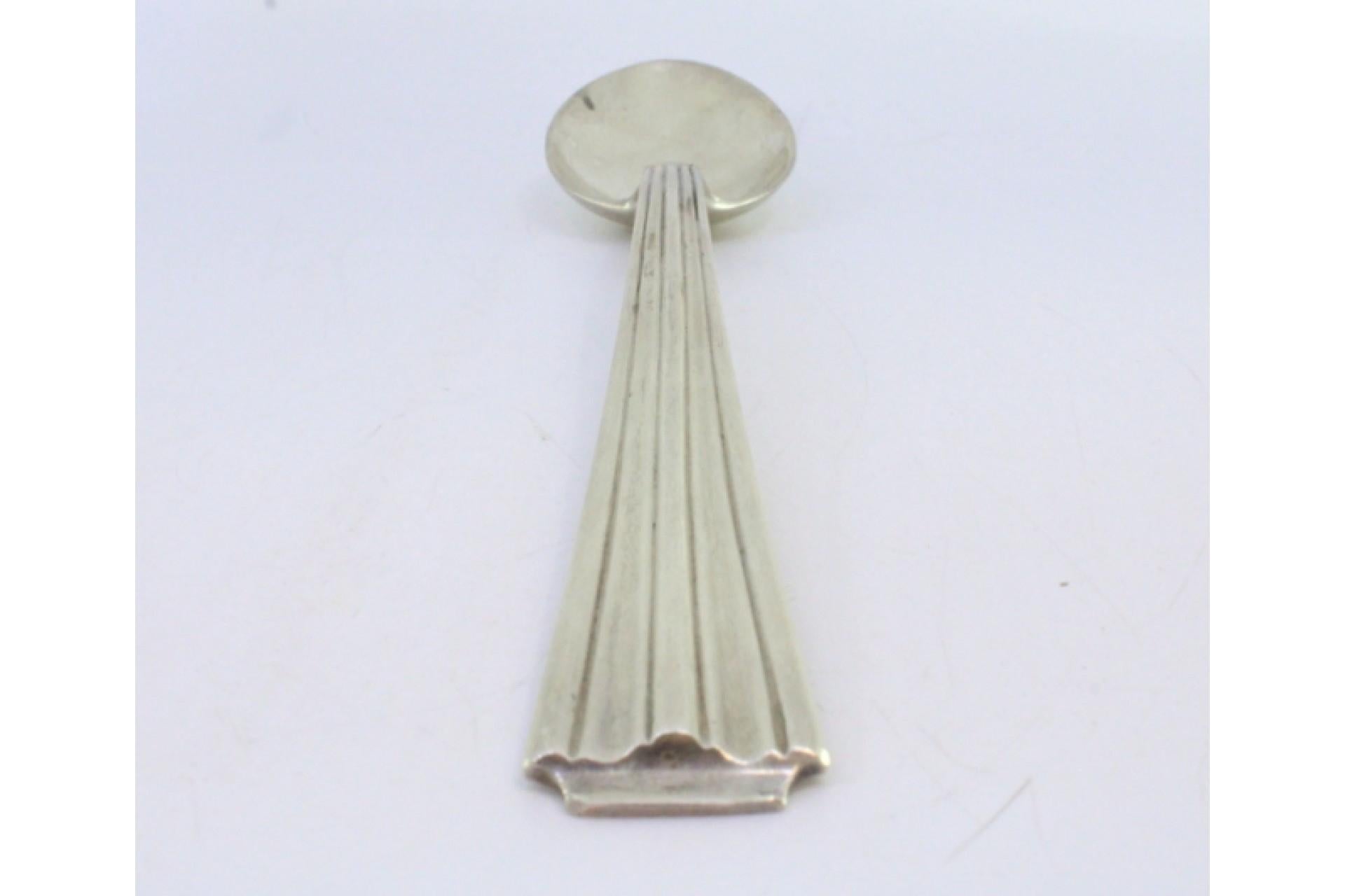 Silver rice and serving spoon with fluted handle Europeo en venta