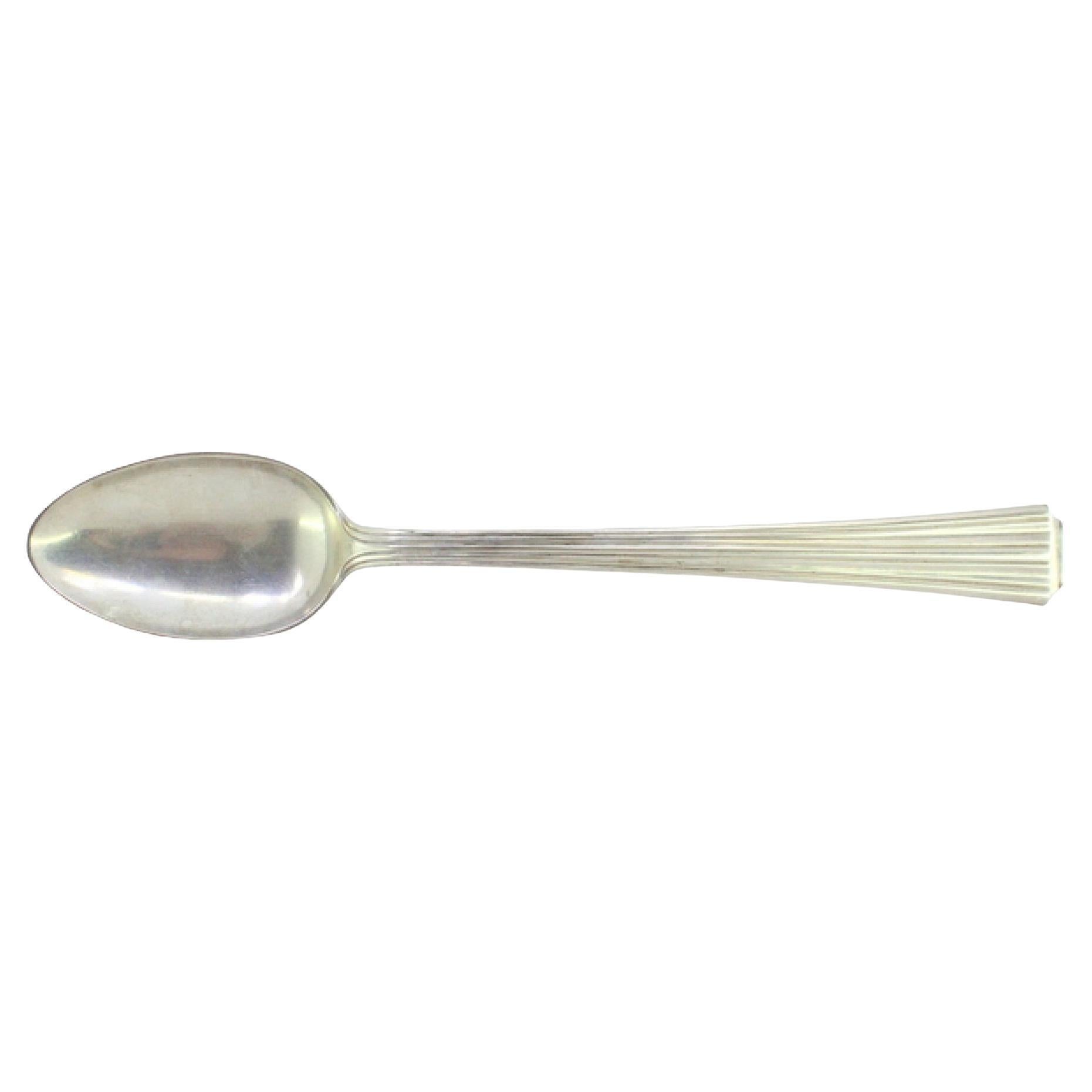 Silver rice and serving spoon with fluted handle