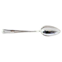Silver rice and serving spoon with friezes and a crown engraved on the handle