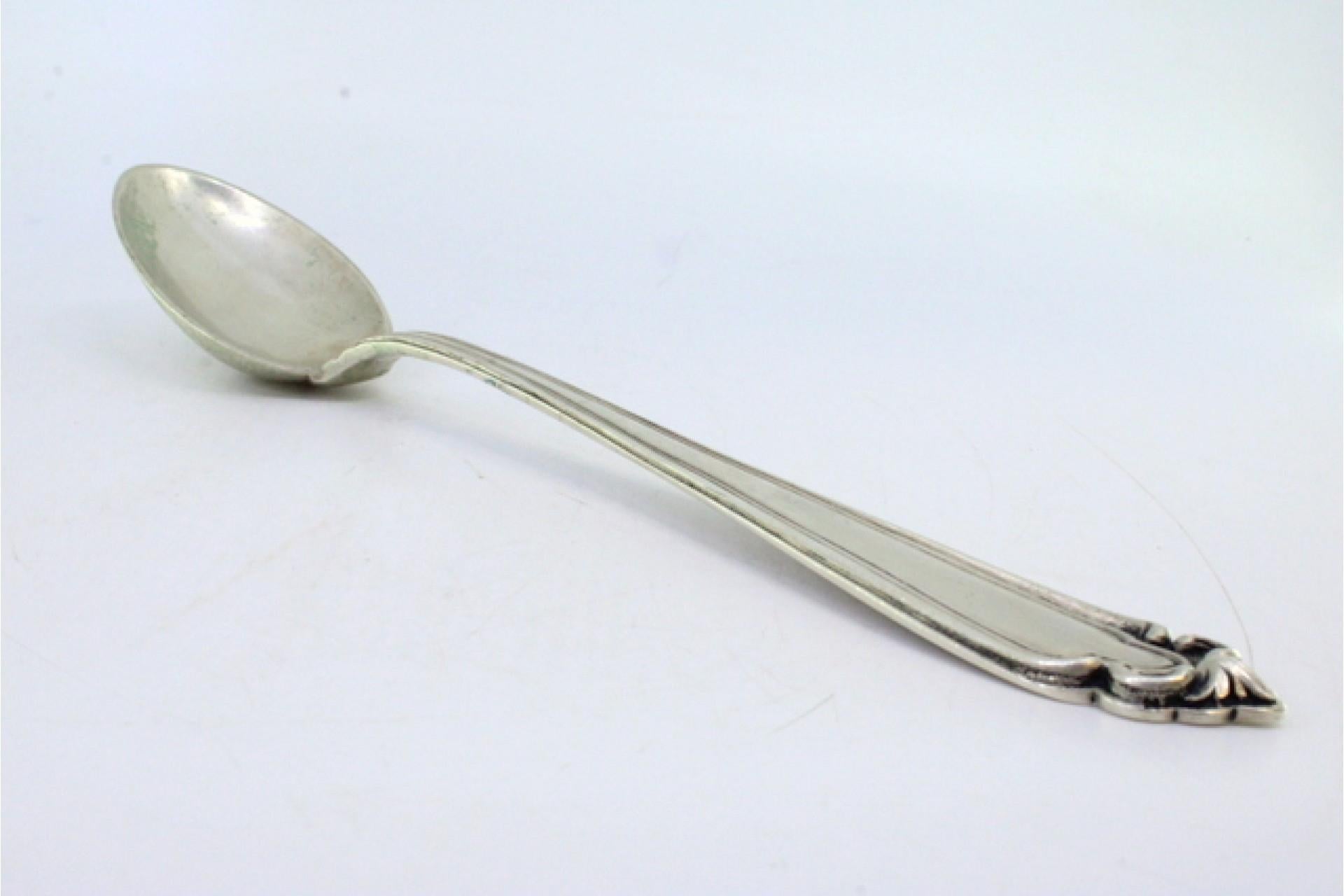 Silver rice and serving spoon with grooves and reliefs on the handle Europeo en venta