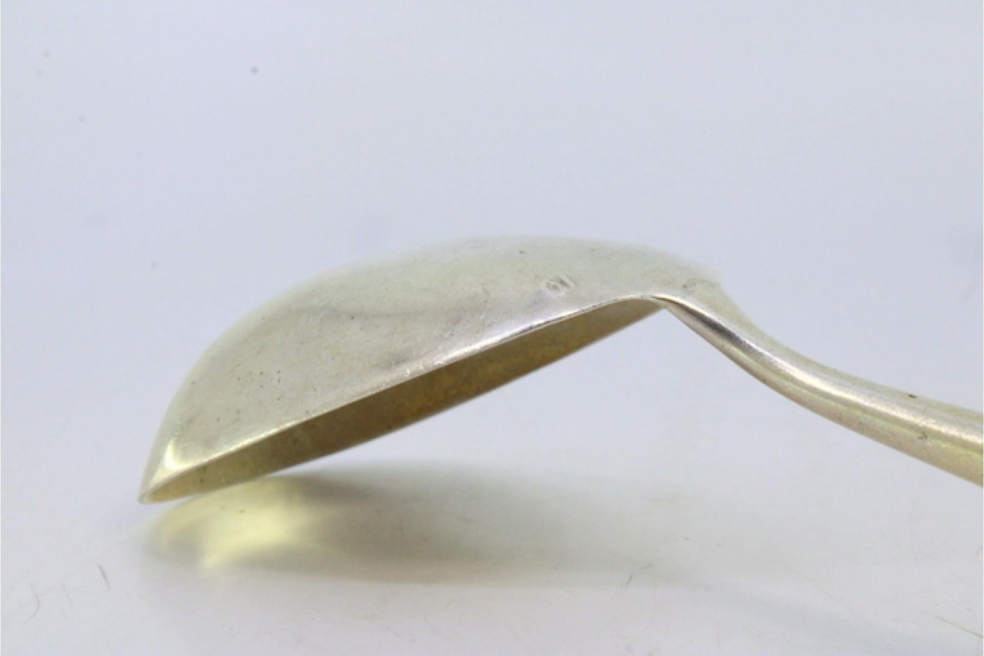 Silver rice and serving spoon with grooves and reliefs on the handle siglo XIX en venta