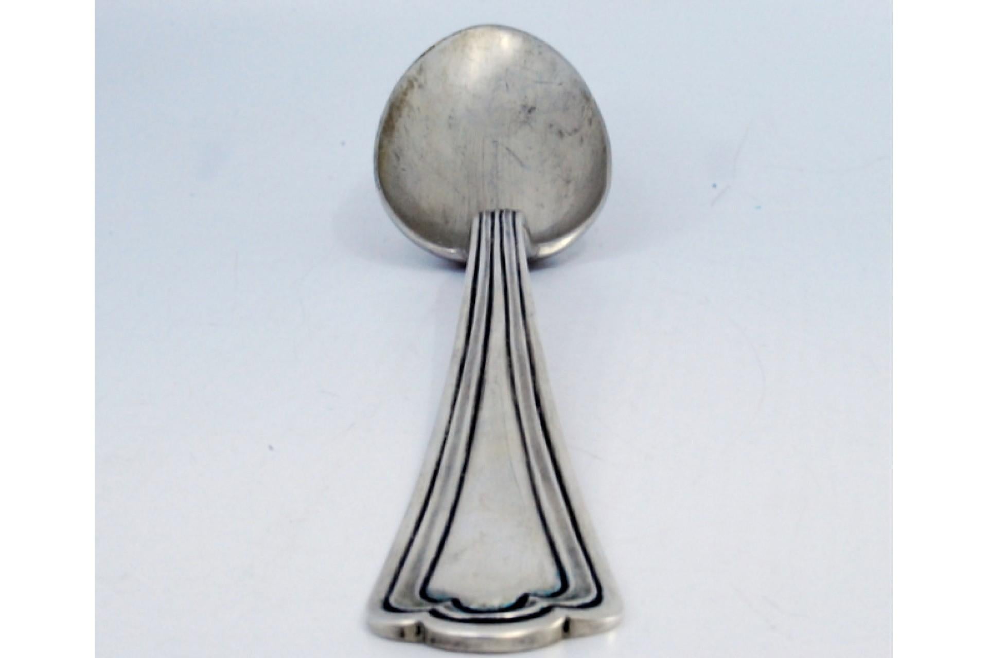 Silver rice and serving spoon with raised grooves along the handle en venta 3