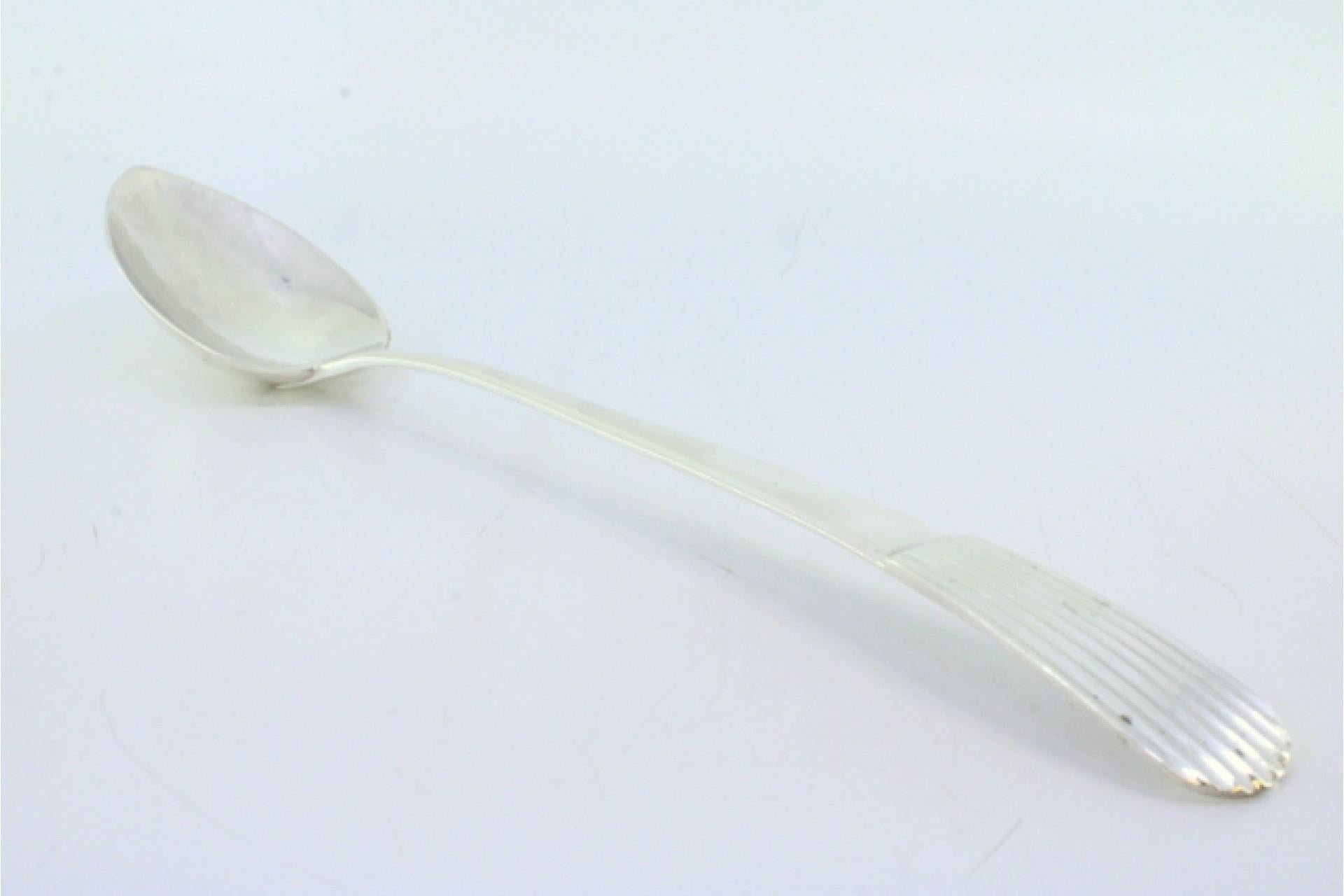 Silver rice and serving spoon with reed-style reliefs on the handle Europeo en venta