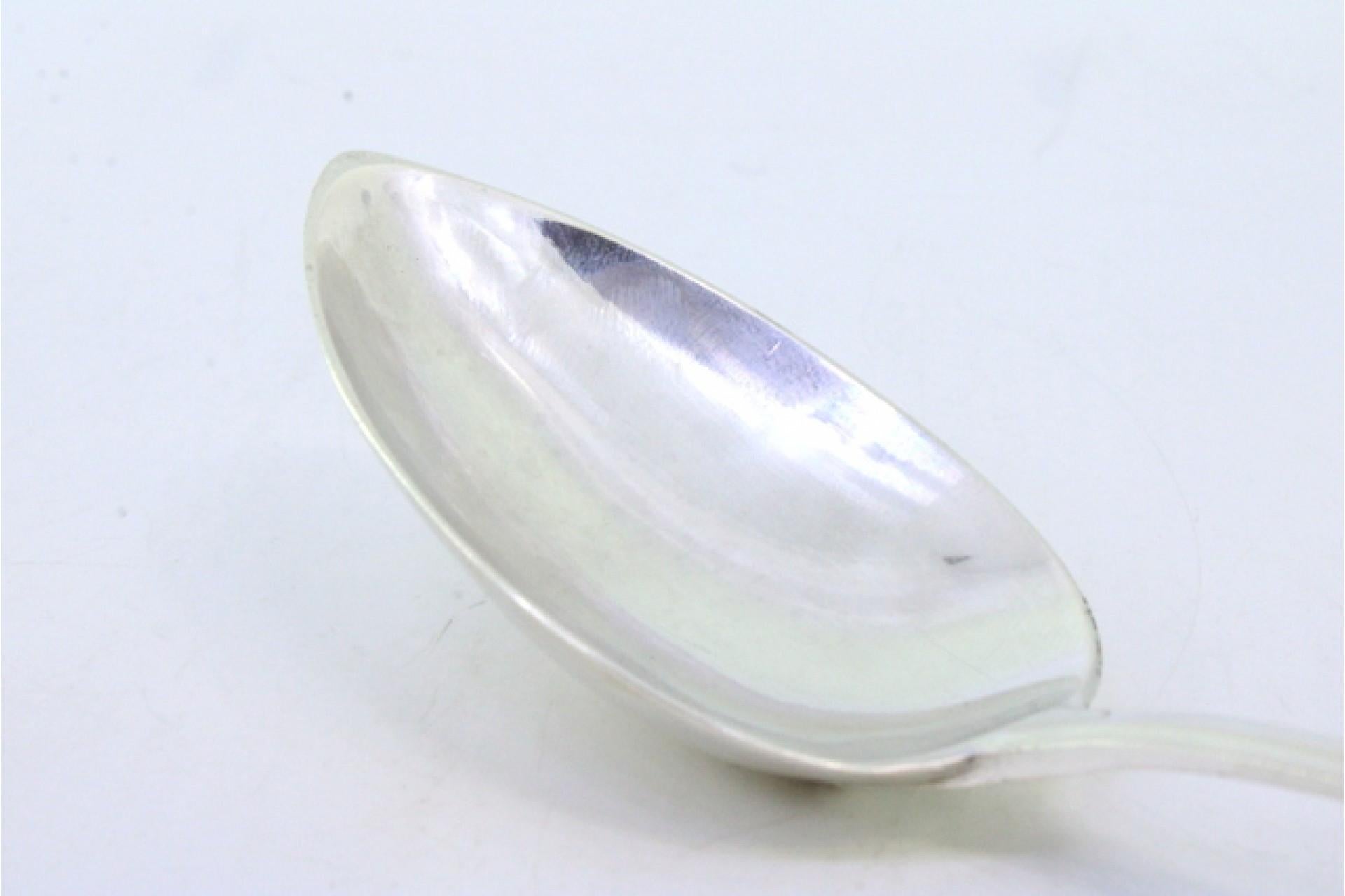 Silver rice and serving spoon with reed-style reliefs on the handle siglo XVIII en venta