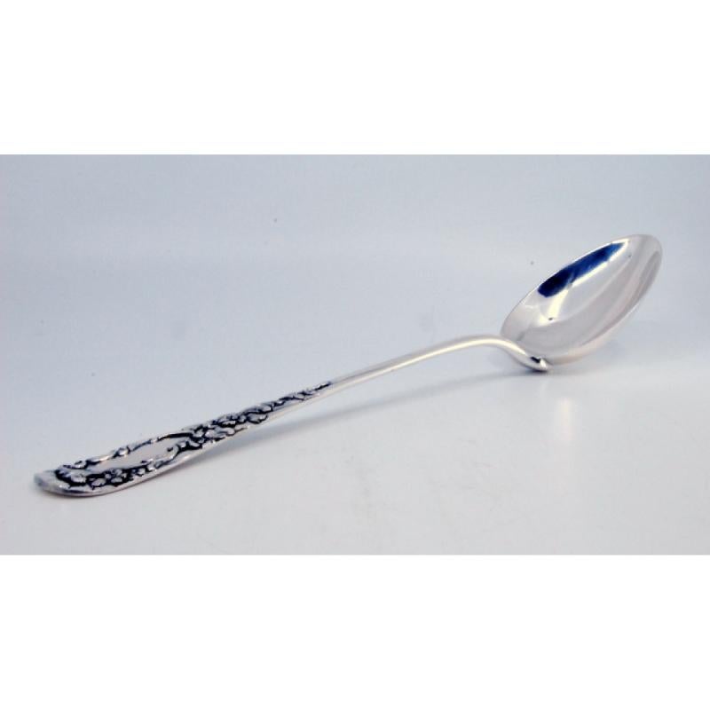 Silver rice and serving spoon with reliefs and a medallion on the handle Europeo en venta