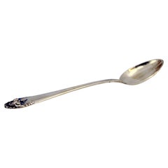 Silver rice and serving spoon with shell shape on the handle