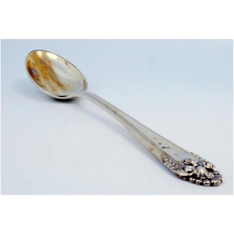 Silver rice and serving spoon with trim and shell shape on the handle Europeo en venta