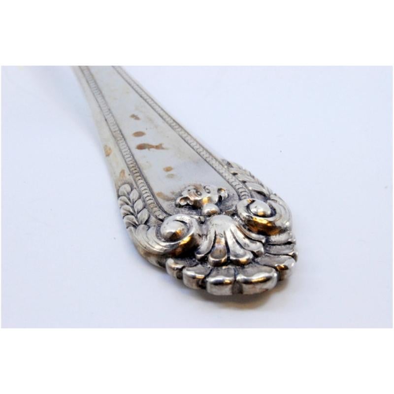 Silver rice and serving spoon with trim and shell shape on the handle siglo XX en venta