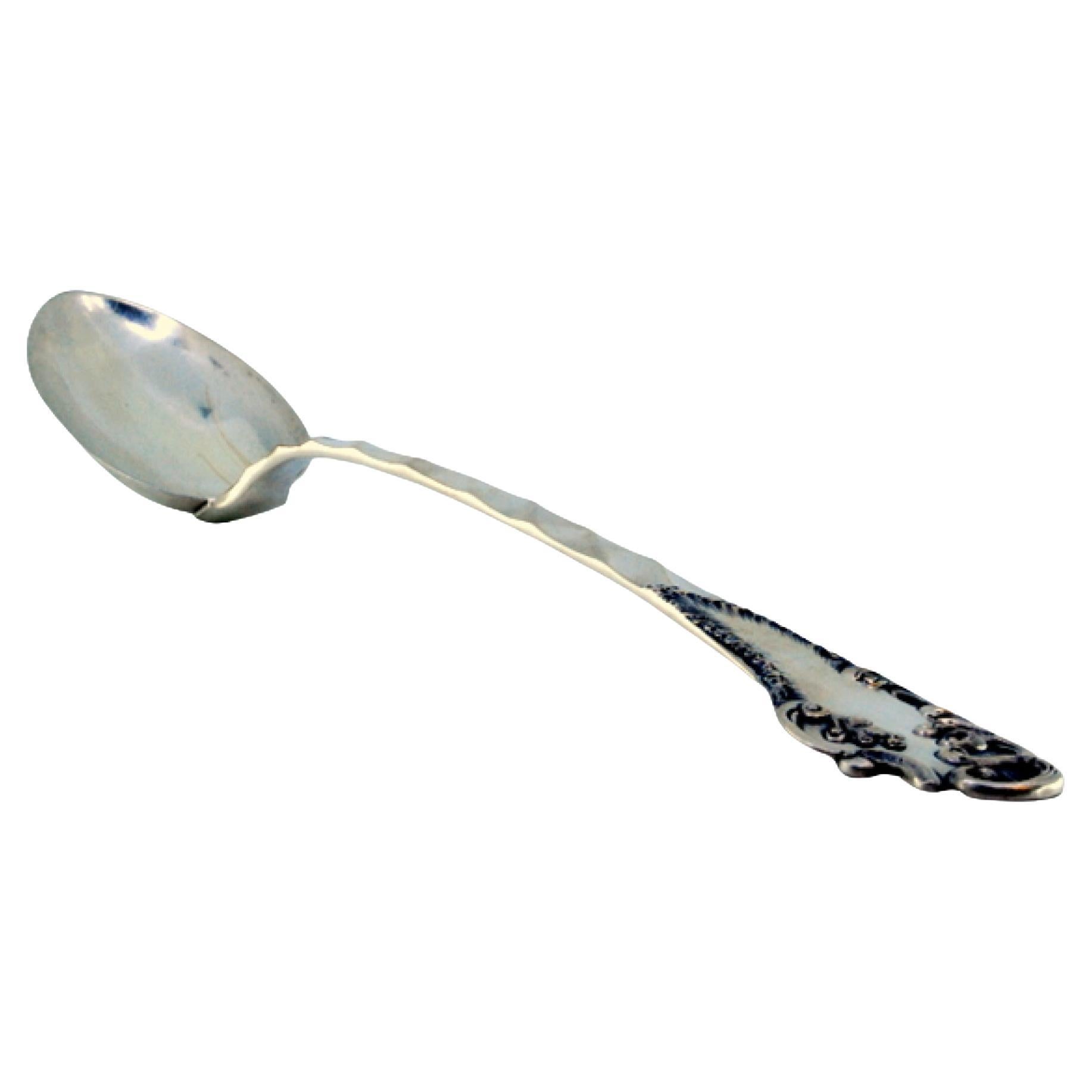 Silver rice and serving spoon with wavy handle and monogram card