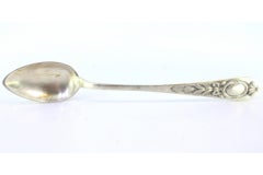 Silver rice & serving spoon w/ floral reliefs on the handle & a monogram card