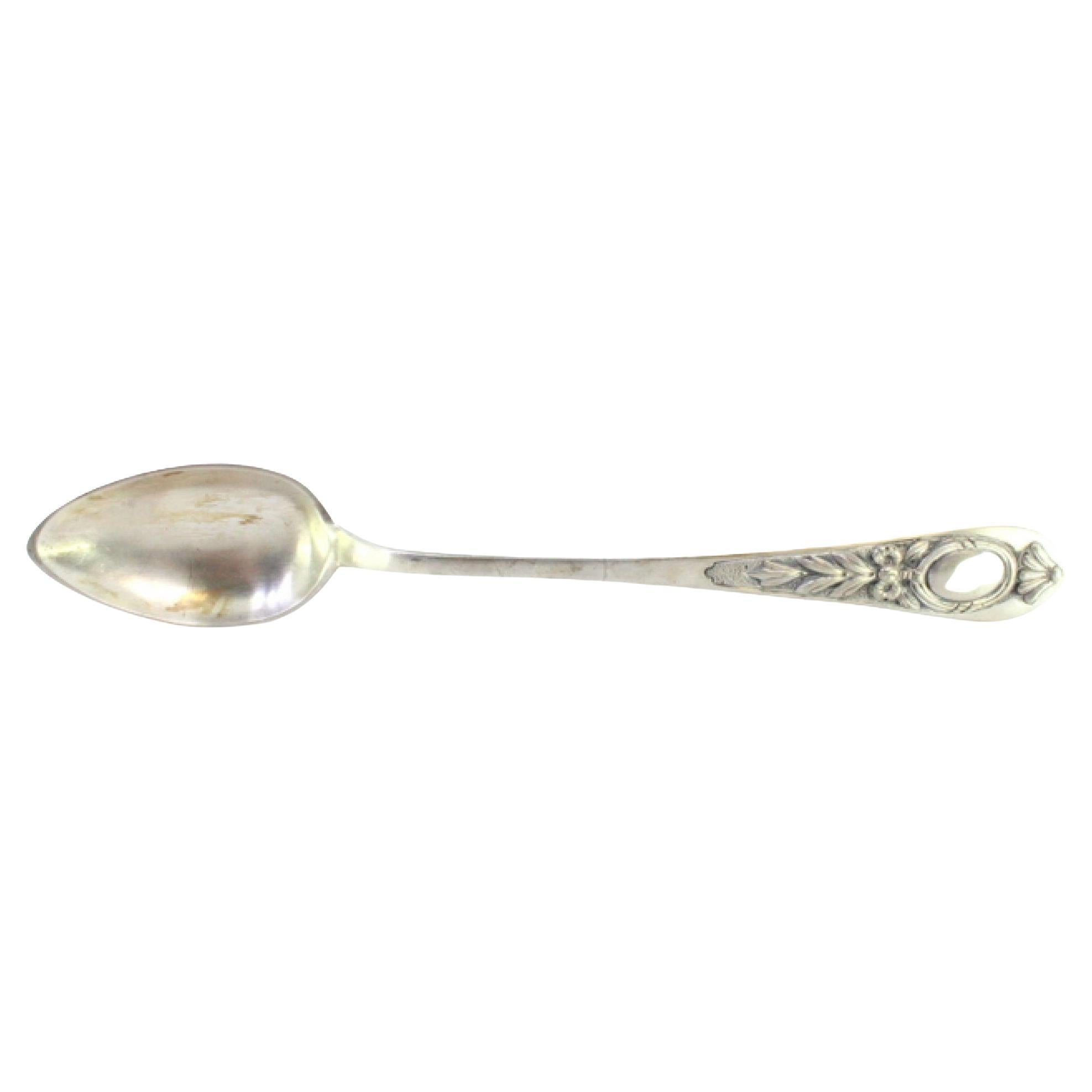 Silver rice
serving spoon w/ floral reliefs on the handle
a monogram card