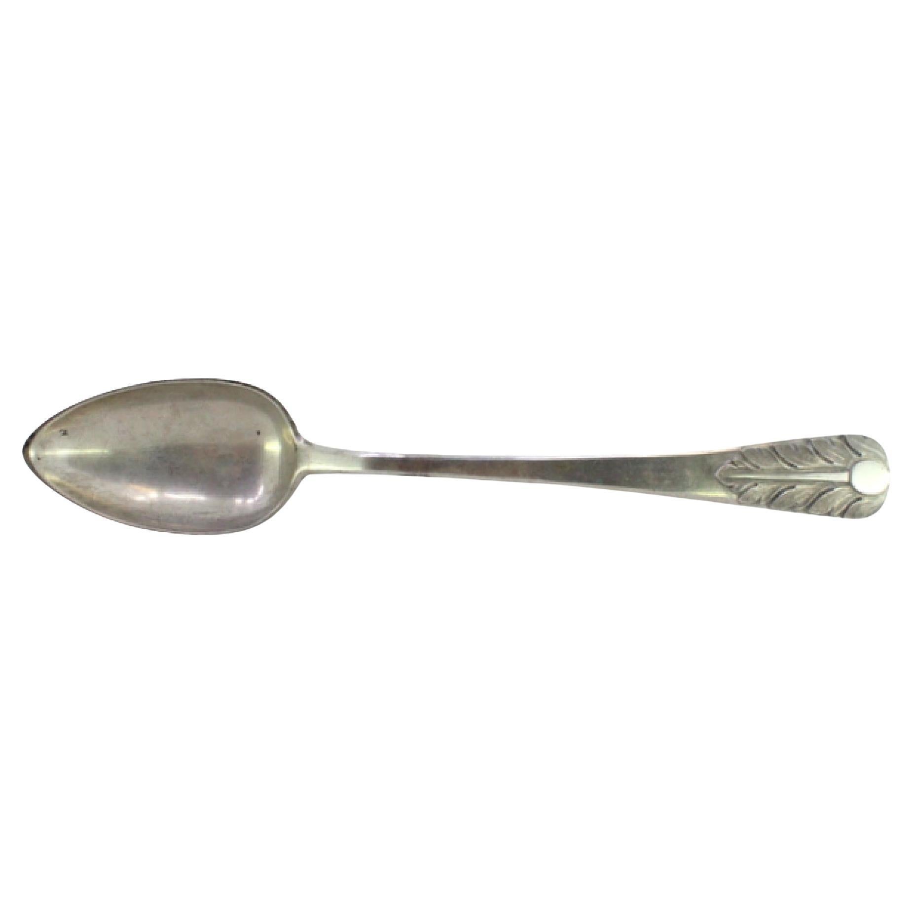 Silver rice/serving spoon with embossed acanthus and monogram plate