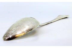 Silver rice/serving spoon with raised-edge handle and monogram plate