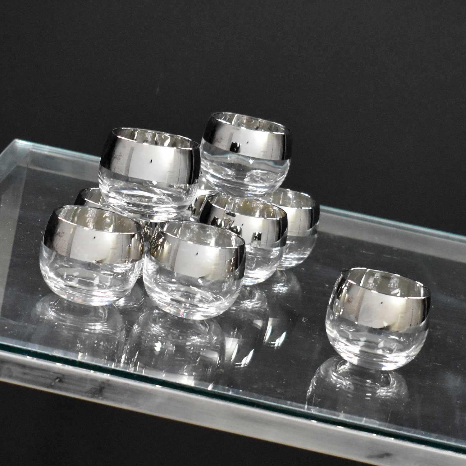 Stunning set of nine silver rimmed roly poly cocktail glasses style of Dorothy Thorpe. They are in wonderful vintage condition with no chips, cracks, or chiggers. There may be small spots of missing silver but nothing major. Please see photos, circa