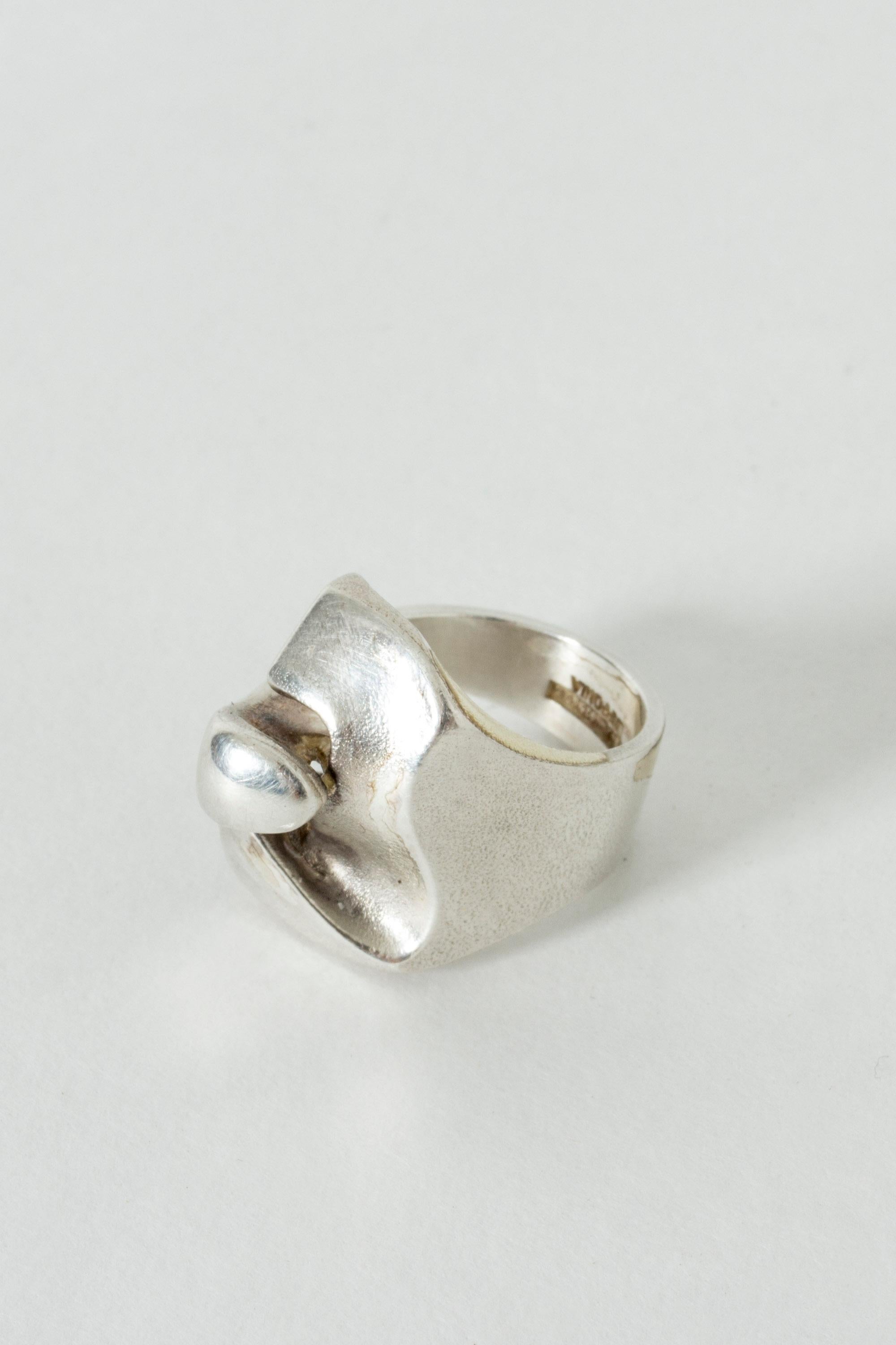 Cool silver ring by Björn Weckström in an interesting, enigmatic design. Brushed surface.