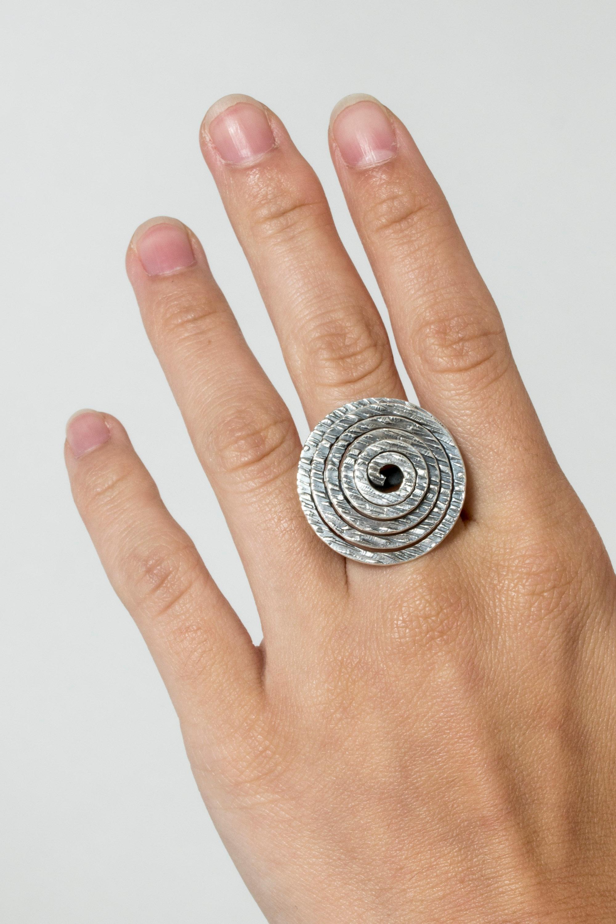 Amazing, expressive silver ring by Elis Kauppi, with a large silver spiral. The surface of the spiral is ethched with an organic pattern.