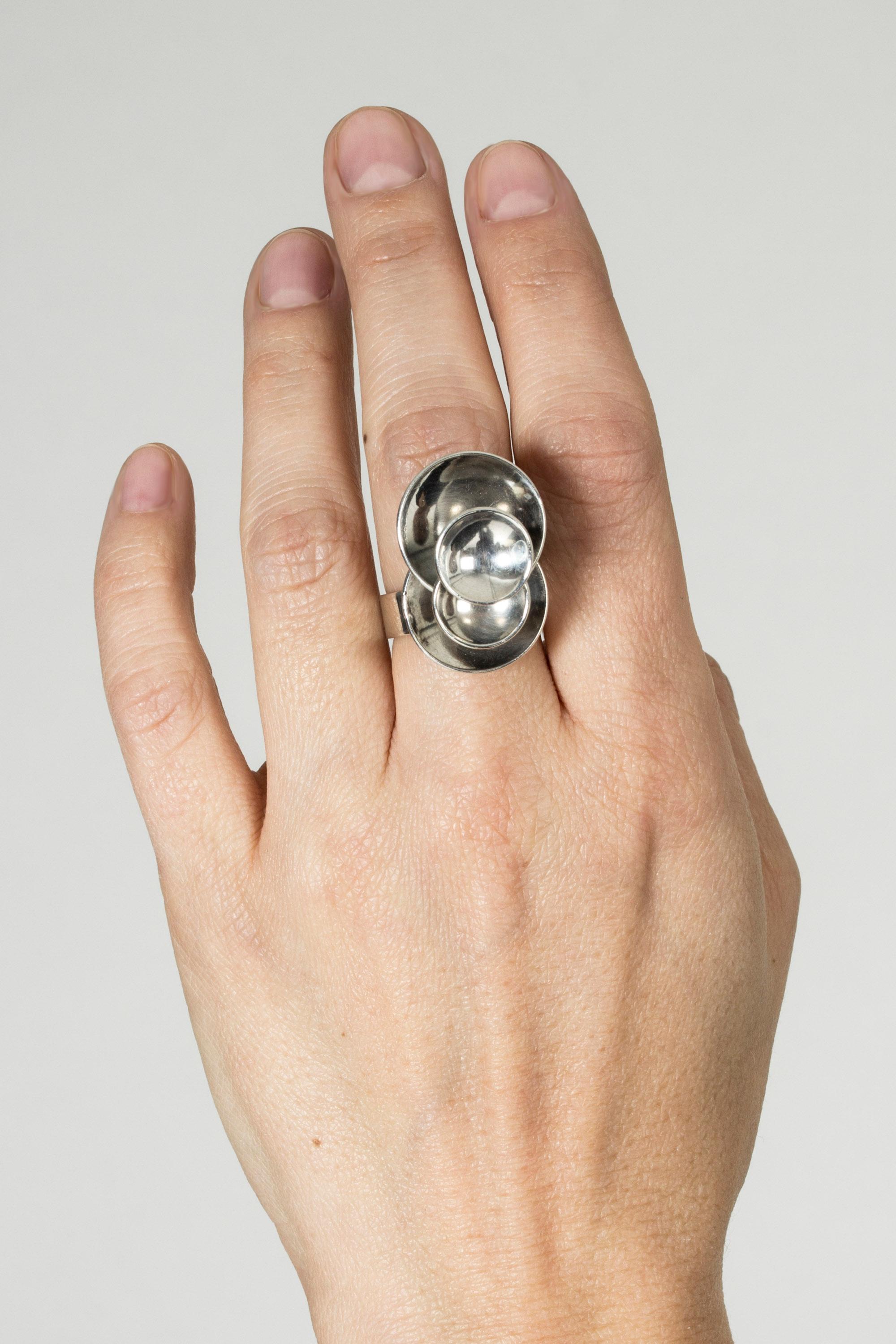 Silver ring by Elis Kauppi in a wonderful, architectonic design of concave spheres building upwards. A small sculpture that plays with perspective!
