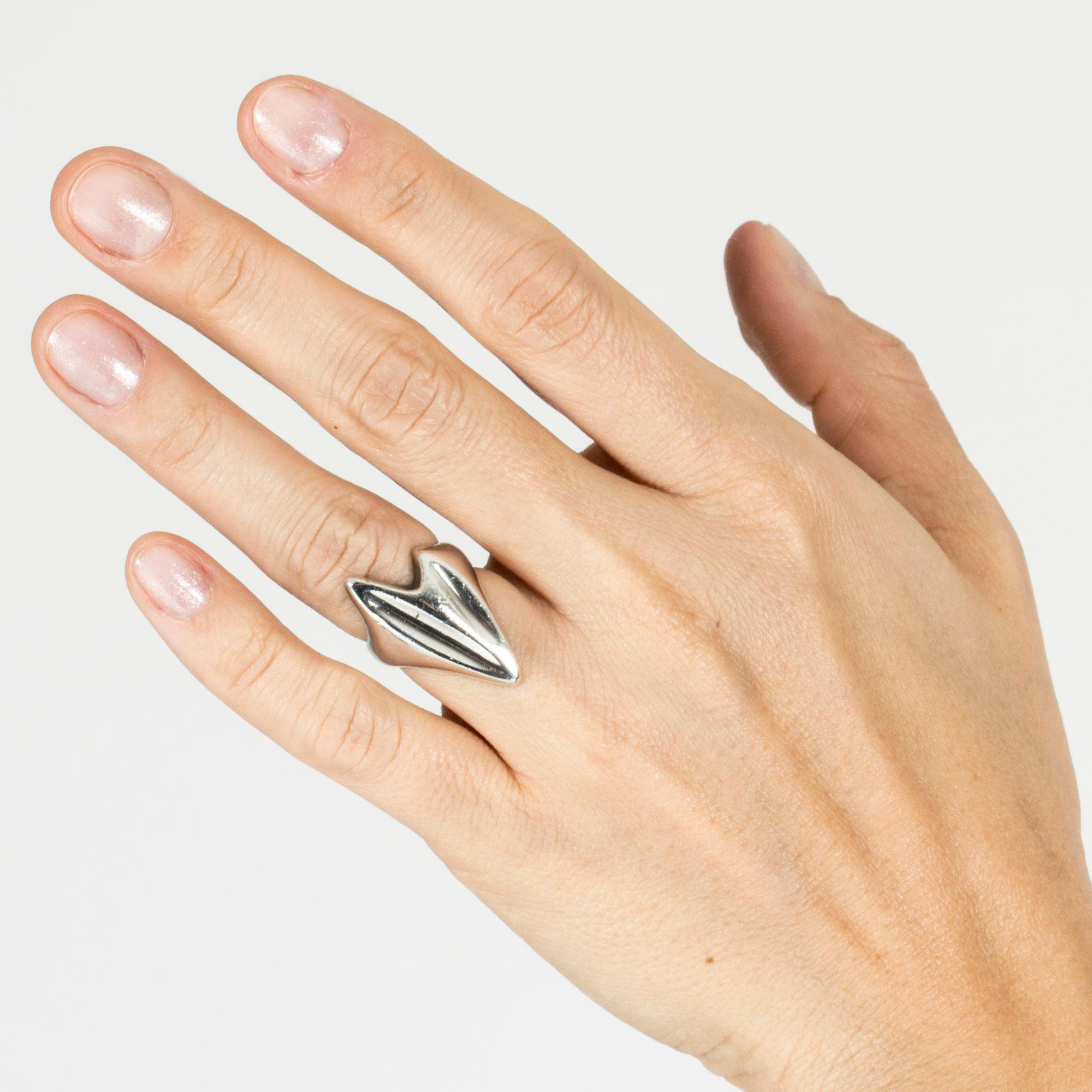 Expressive silver ring by the groundbreaking designer Henning Koppel who was responsible for taking the firm Georg Jensen to new heights from when he started there in 1946. He was a self-stated anti-functionalist and worked with imaginative