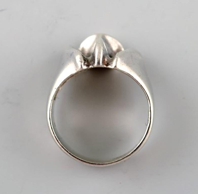 Silver ring from Lapponia, Finland.
Vintage modernist ring in sterling silver, handmade.
1960 s.
Stamped.
Measures 16 mm. Size 5,5 (USA). Our jeweler can adjust to any size for an additional $50.