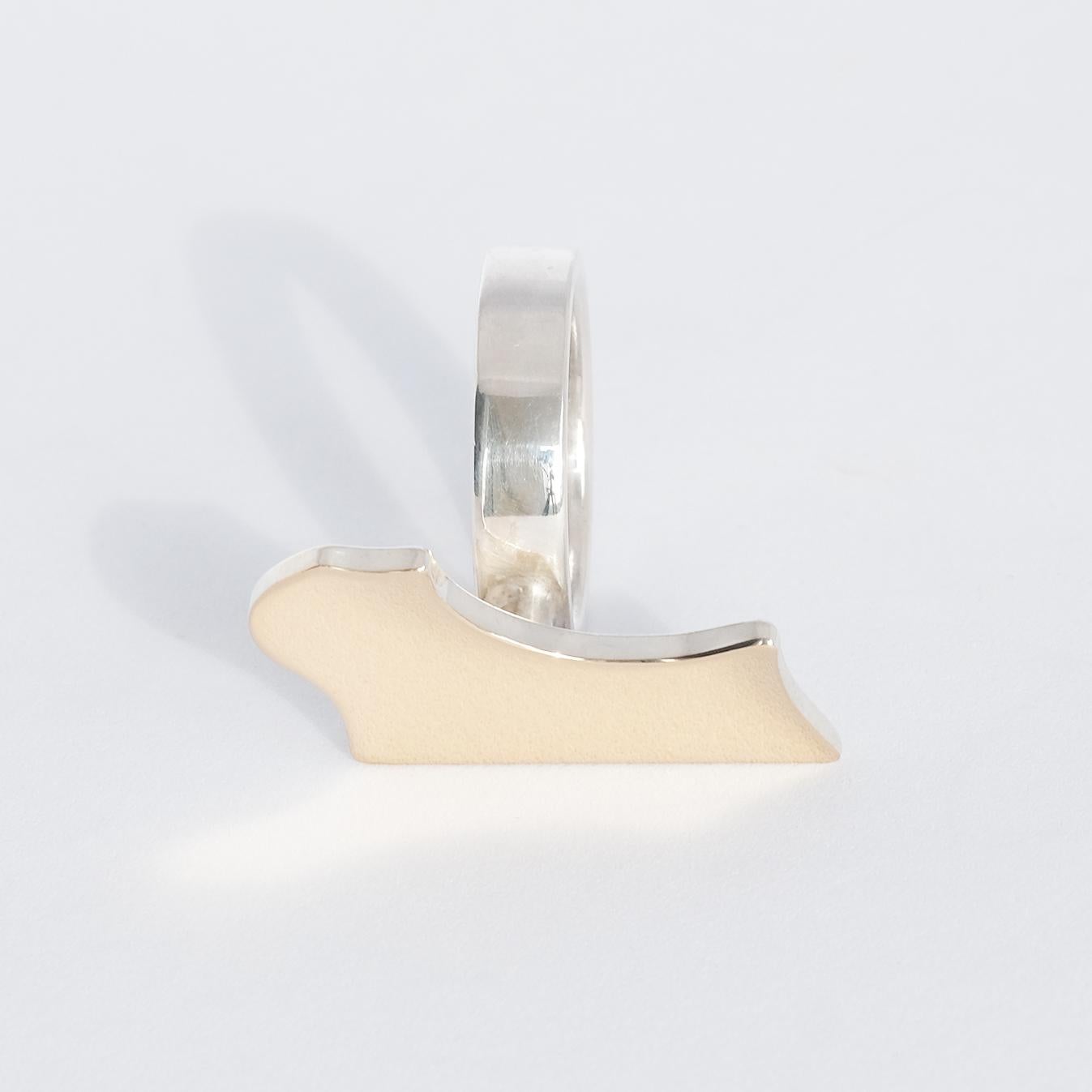 This sterling silver ring has gold on its top. Made by Sigurd Persson Sweden 1978.

 This joyful creation looks like a piece of a puzzle. 

The ring has an unique form and it radiates attitude. It is a perfect fit in both an everyday environment