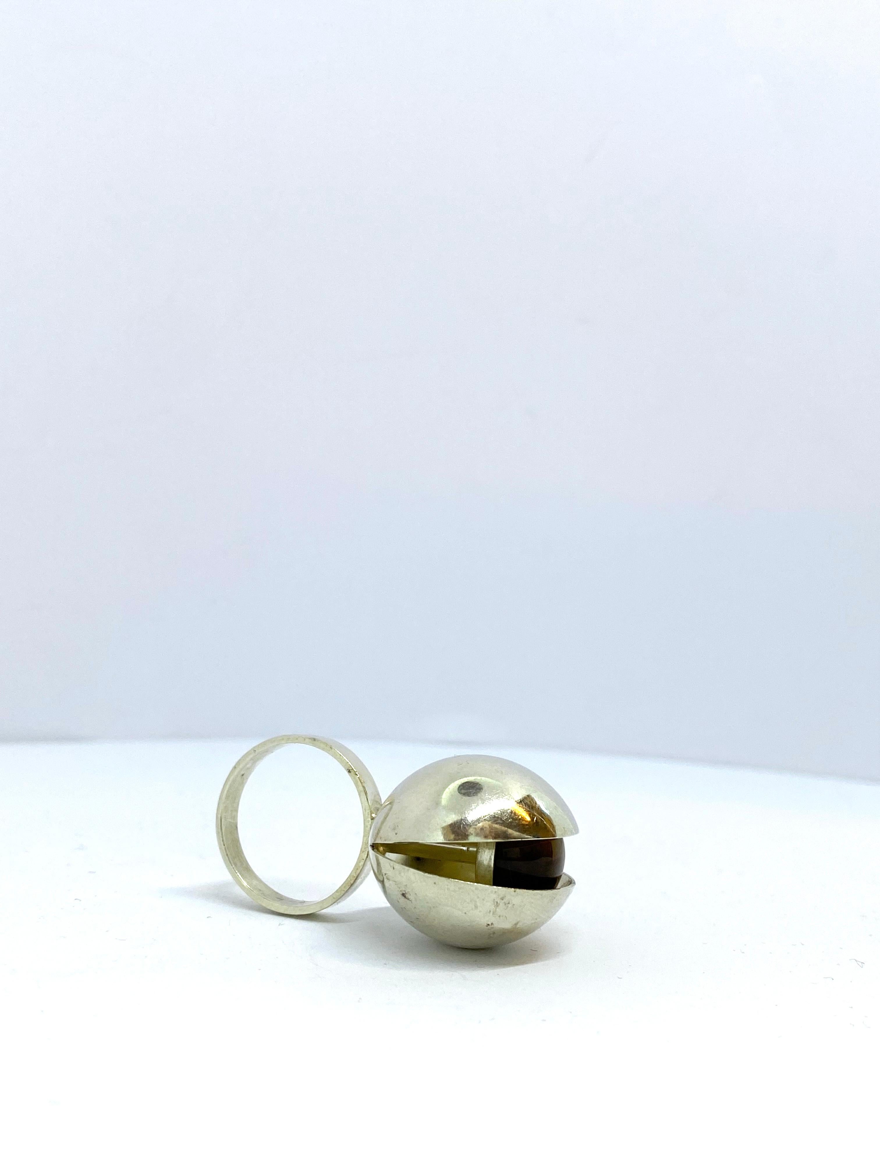Silver Ring Tiger Eye Stone 
Really great and spectacular Ring.
Reminiscent of a Mussel every little bit open and the 