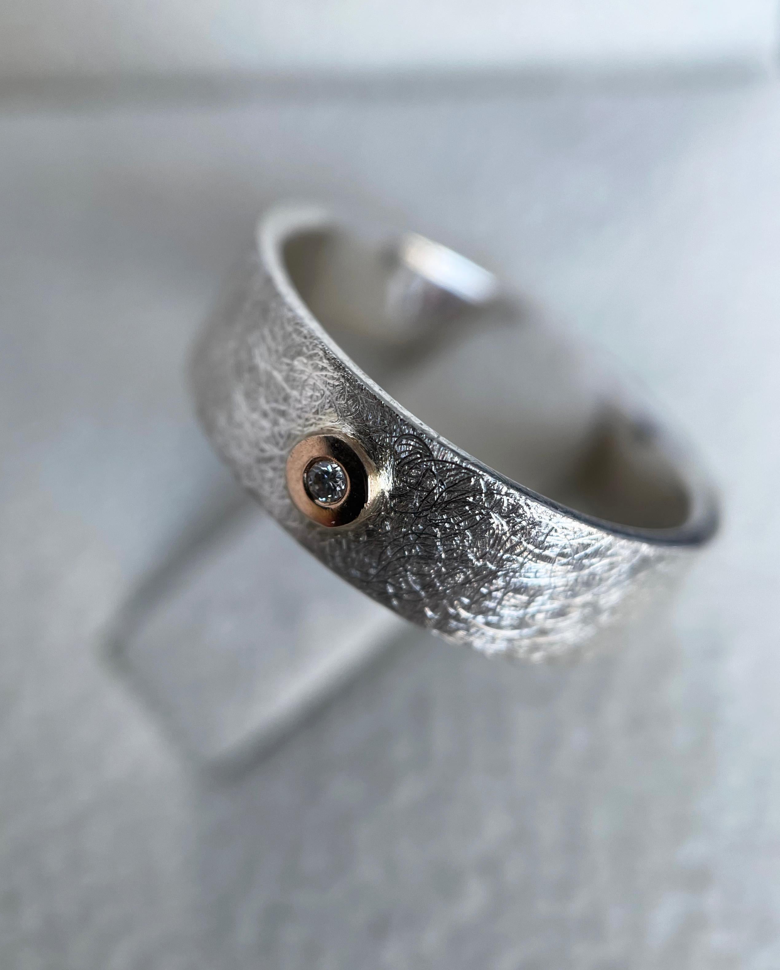 Silver ring with Zircon and gold detail - modern and stylish piece of jewelry.

If you are looking for a ring you could and would like to enjoy every day, this both simple, sophisticated, and contemporary design ring is your gratifying