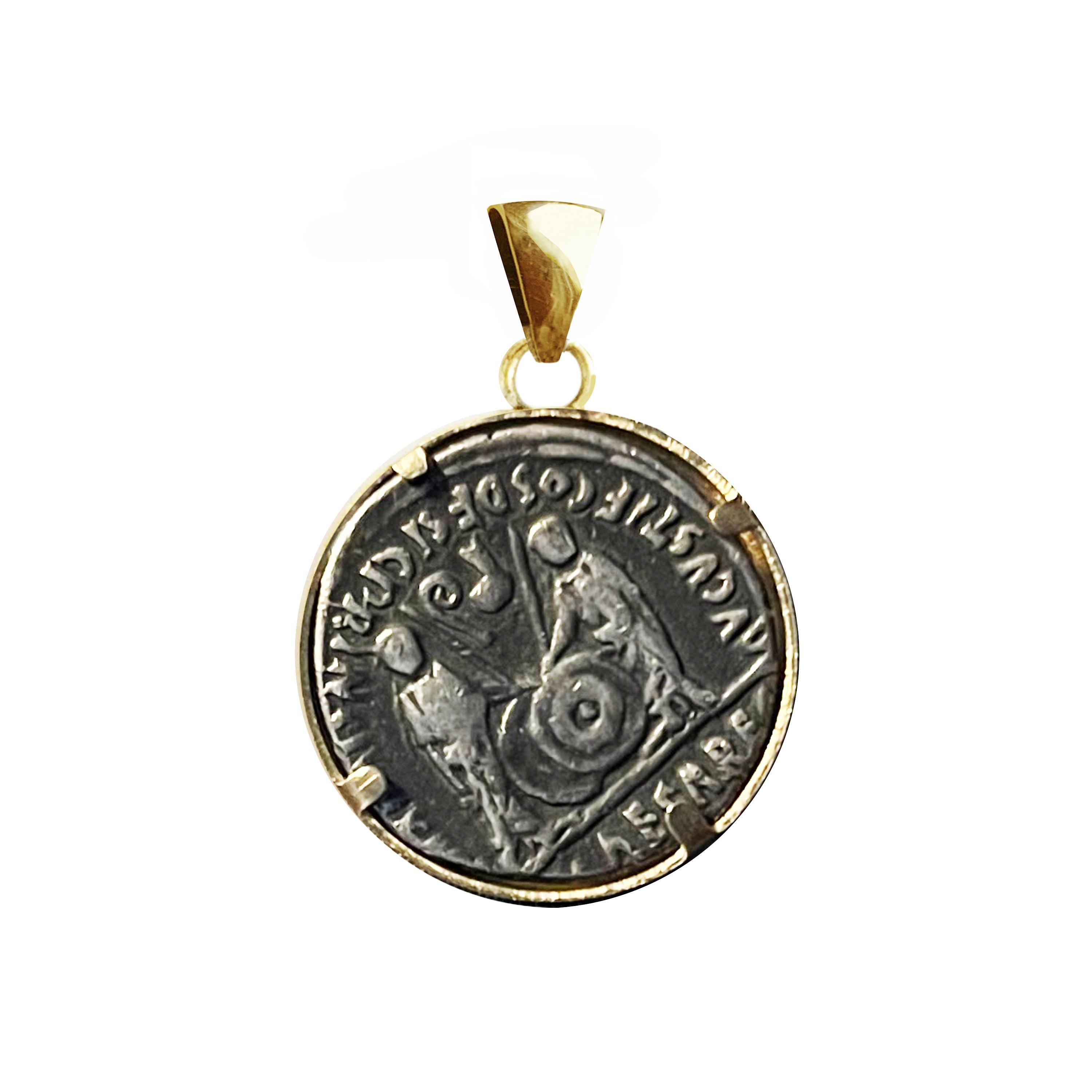 In this interesting 18 kt gold pendant has been set an authentic Roman silver coin representing the first of the Roman emperors, Augustus( 27 BC-14 AD ).
In the reverse side of the coin we can see Gaius and Lucius Caesar togate standing facing,