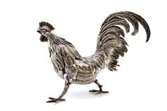 Silver rooster with reliefs and applications