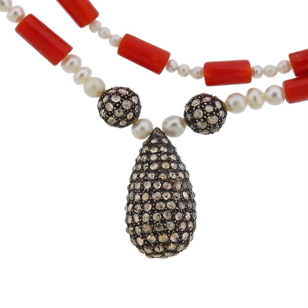 Long necklace with coral and pearl gemstones, featuring silver pendant with rose cut diamonds approx. 210 stones. Measures necklace - 41