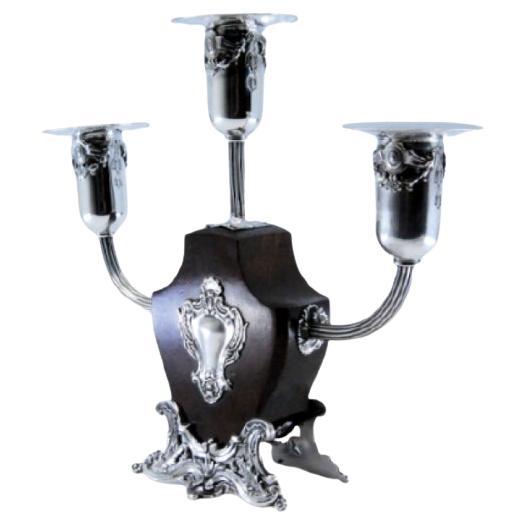 Silver-rosewood candelabra with three lights 
monogram plaque en vente