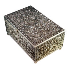 Silver safe-shaped box with floral motifs on four spherical feet