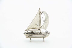 Silver sailing boat miniature