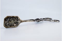 Silver salad, bread or sauce tongs with palm appliqués on the handle