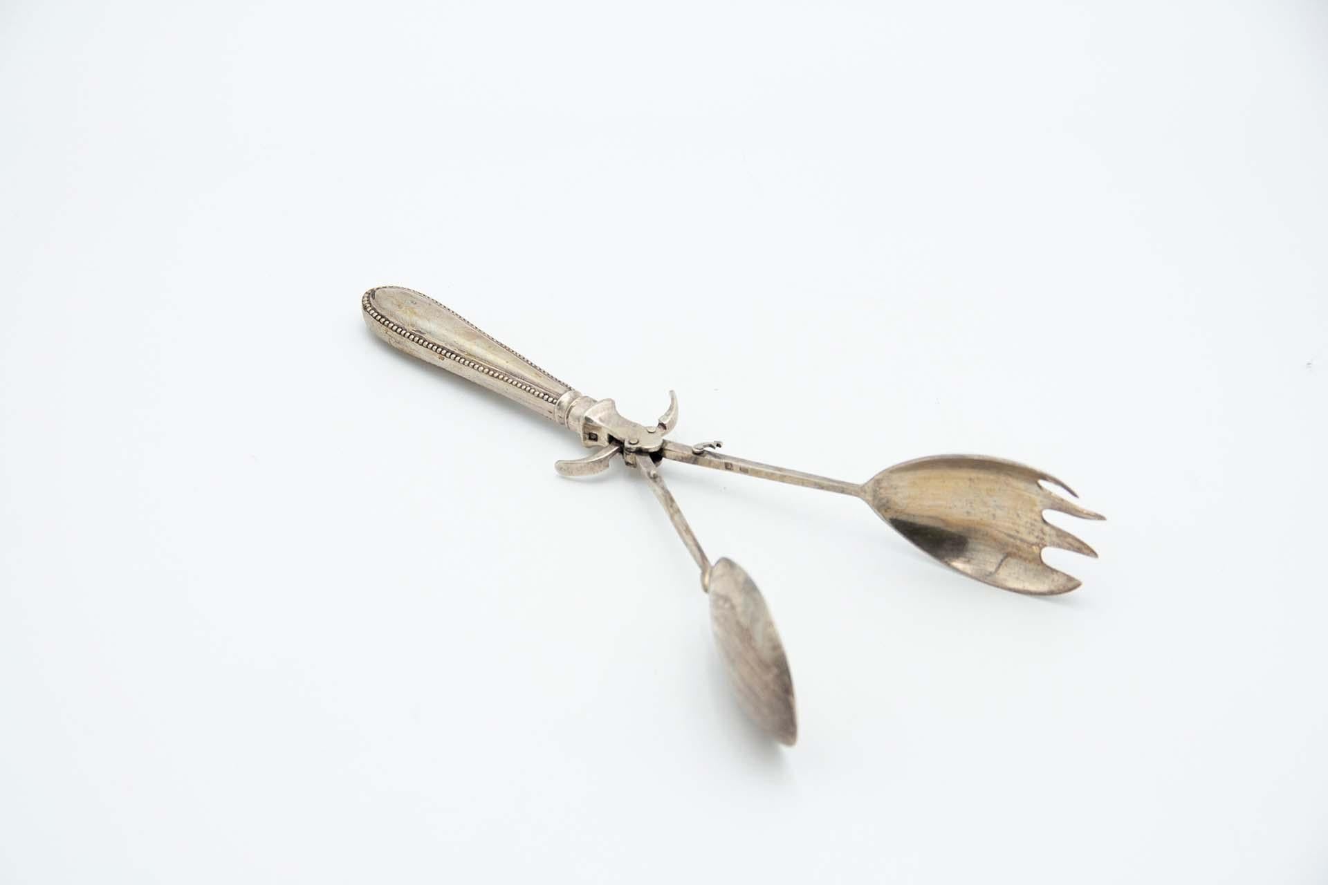Silver salad or bread tongs
