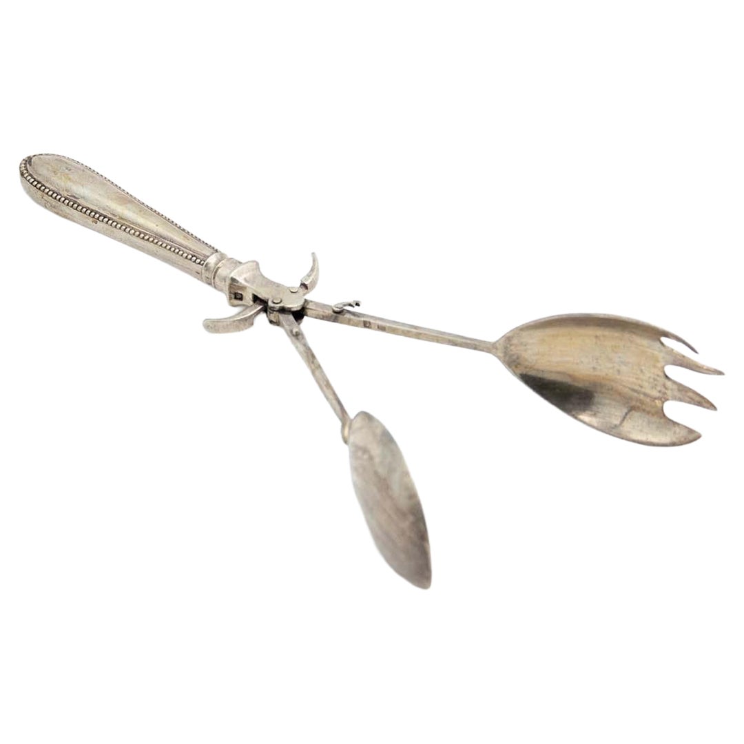 Silver salad or bread tongs