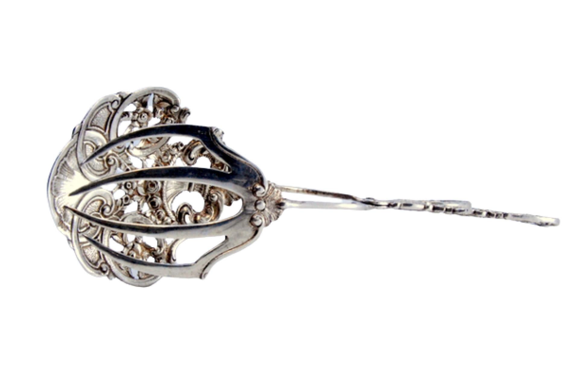 Silver salad or bread tongs with a cutout on the shell and relief on the stems For Sale