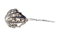 Silver salad or bread tongs with a cutout on the shell and relief on the stems